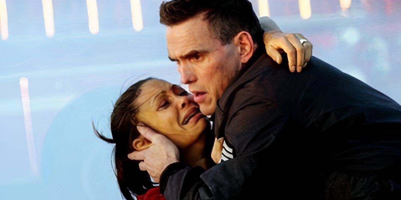 A woman is gripping onto a man while she sobs hysterically in Crash 2004