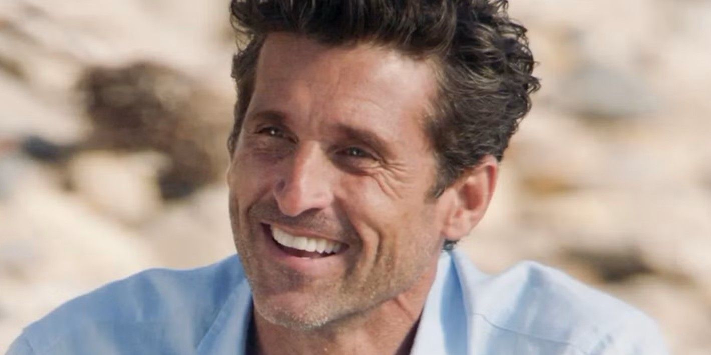 Derek Shepherd sits on a beach in casual clothes talking to Meredith in her dream in Grey's Anatomy.
