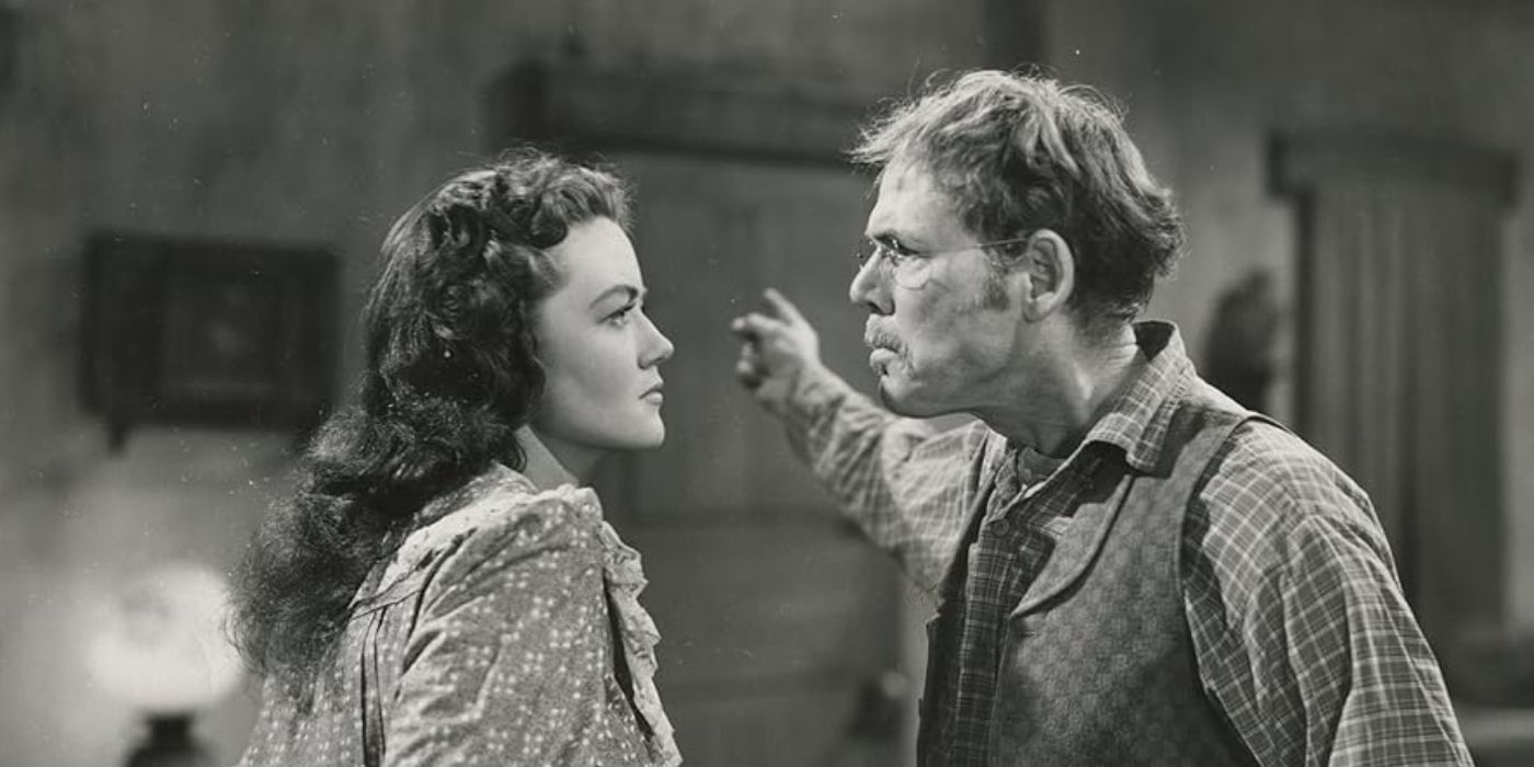 Dorthy Malone stands in front of her costar arguing with him in Colorado Territory