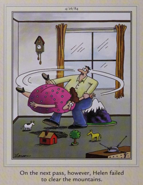 A man swings a woman in a living room