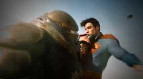 Hammer of Boravia in one quarter shot grabbing Superman by the neck as he closes his eyes and winces in pain from Superman 2025