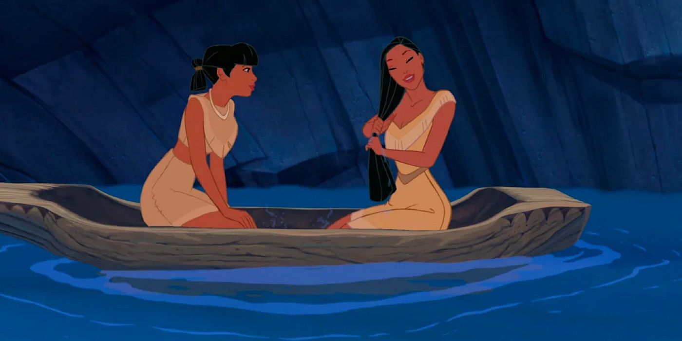 Pocahontas and Nakoma in a boat made from a tree truck.
