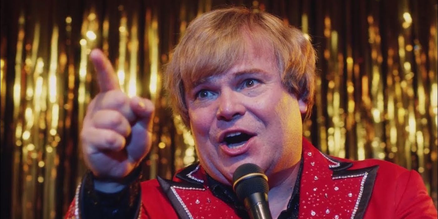 Jack Black as Jan Lewan pointing while singing