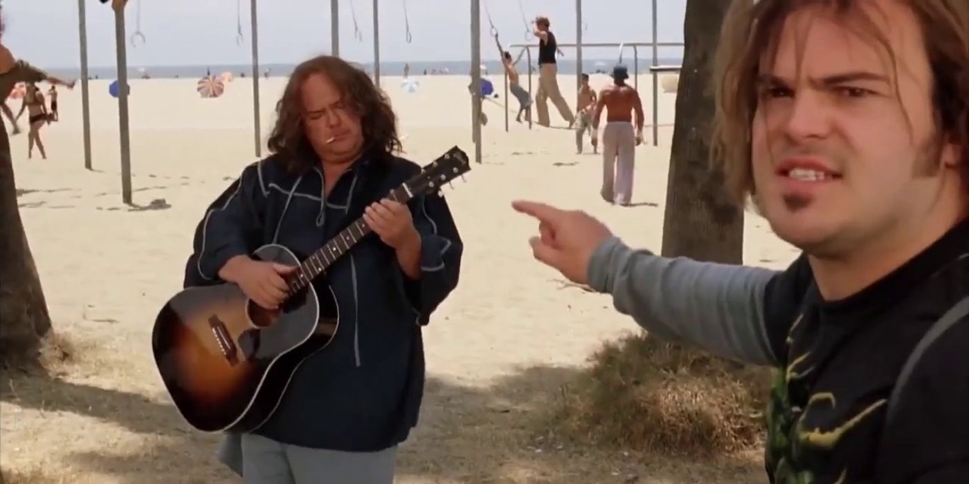 J.B. (Jack Black) points to K.G. (Kyle Gass) as the latter plays