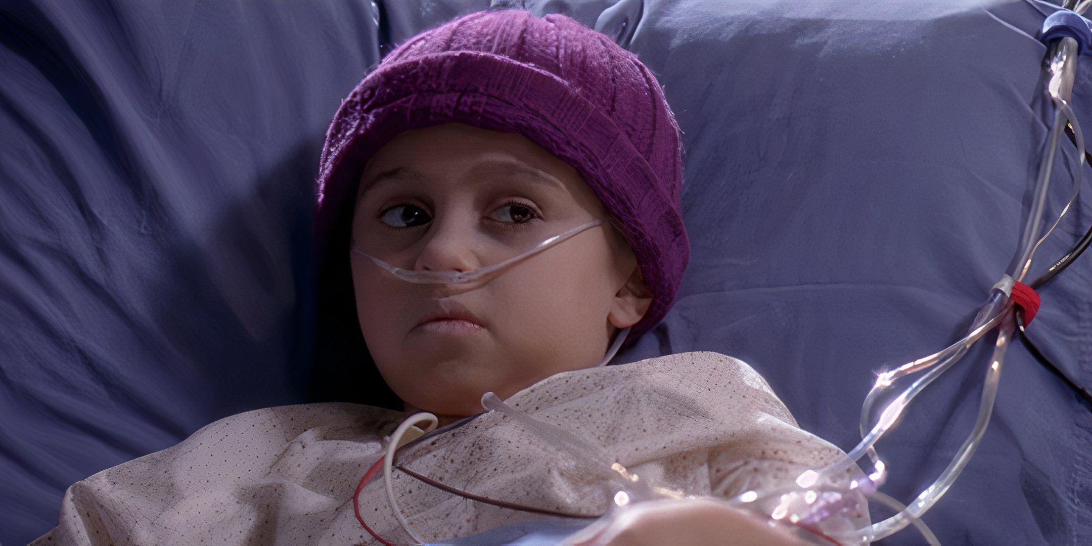 Jessica Smithson lying weakly in her hospital bed in Grey's Anatomy