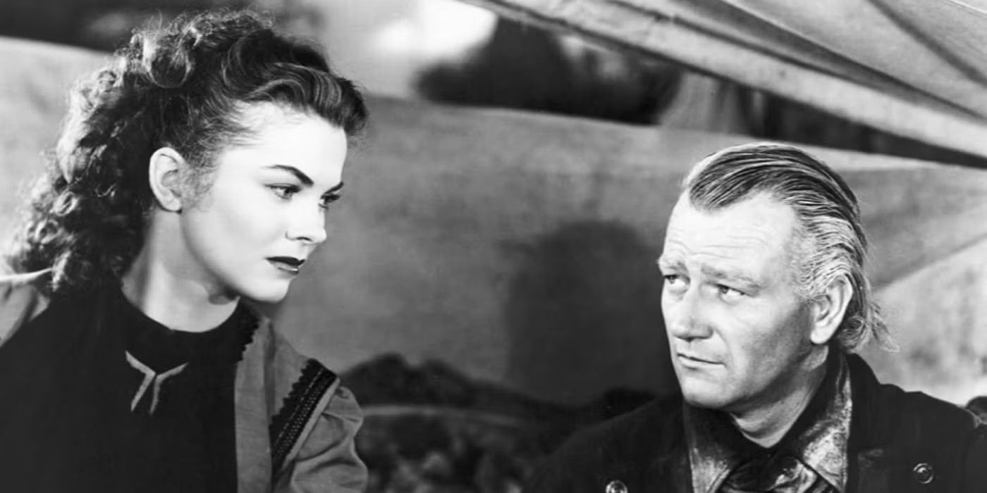 Joanne Dru and John Wayne talk to one another in Red River