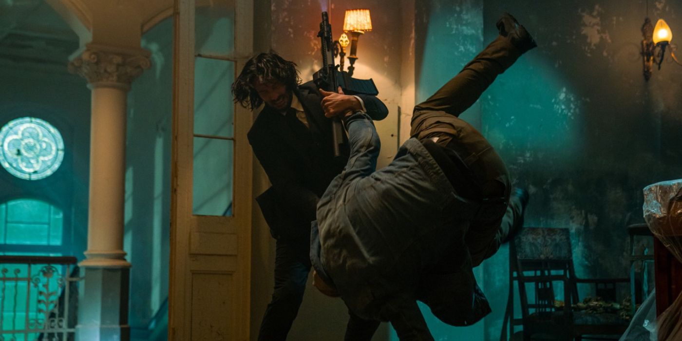 Keanu Reeves as John Wick fighting a goon from John Wick: Chapter 4 (2023)