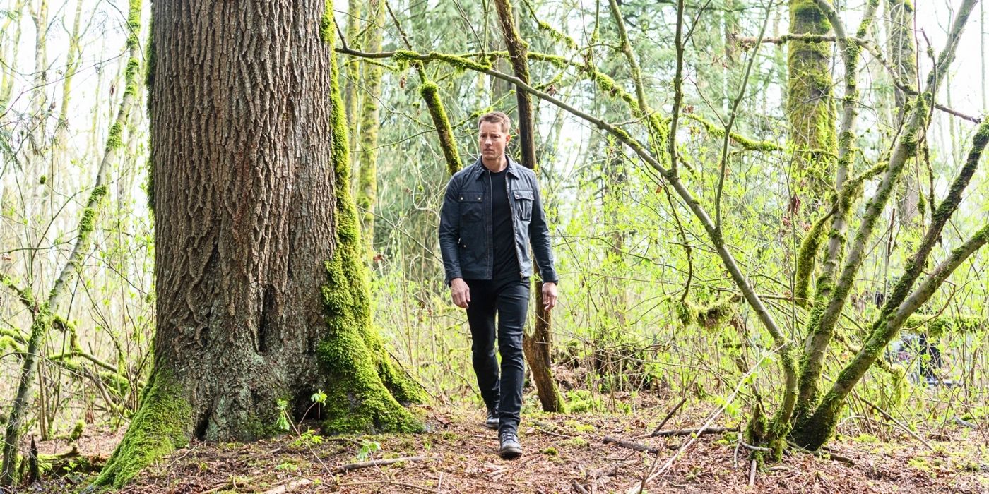 Justin Hartley as Colter walking in the woods in Tracker 'Echo Ridge'