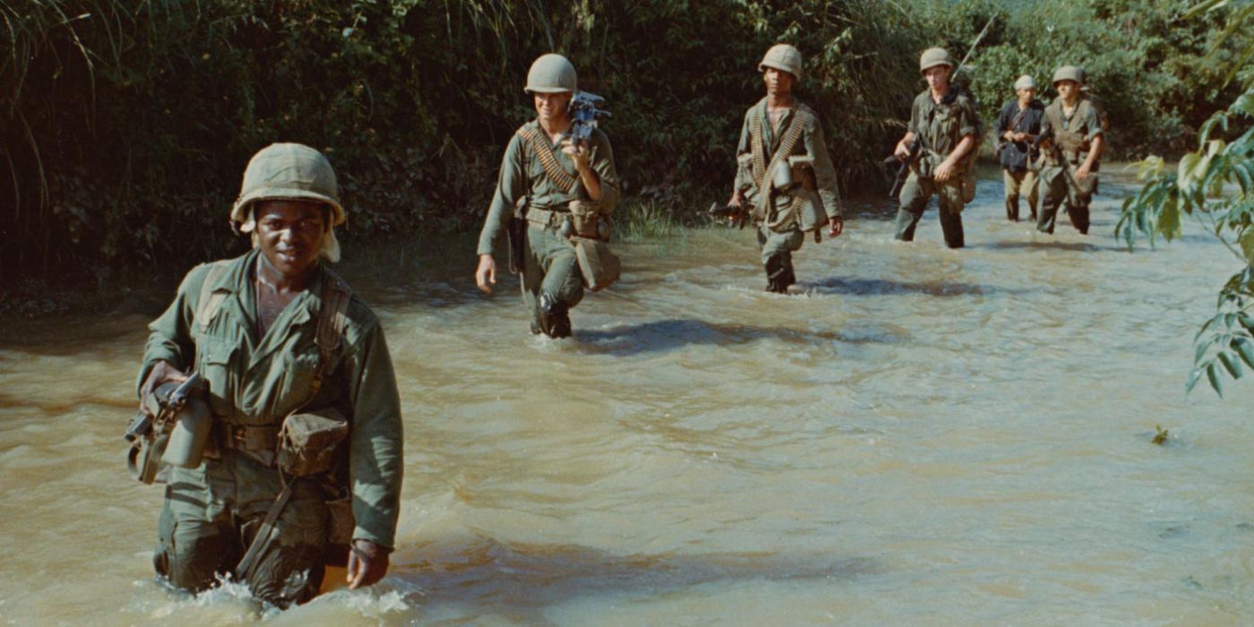 A group of soldiers walking through water from the TV series The Vietnam War