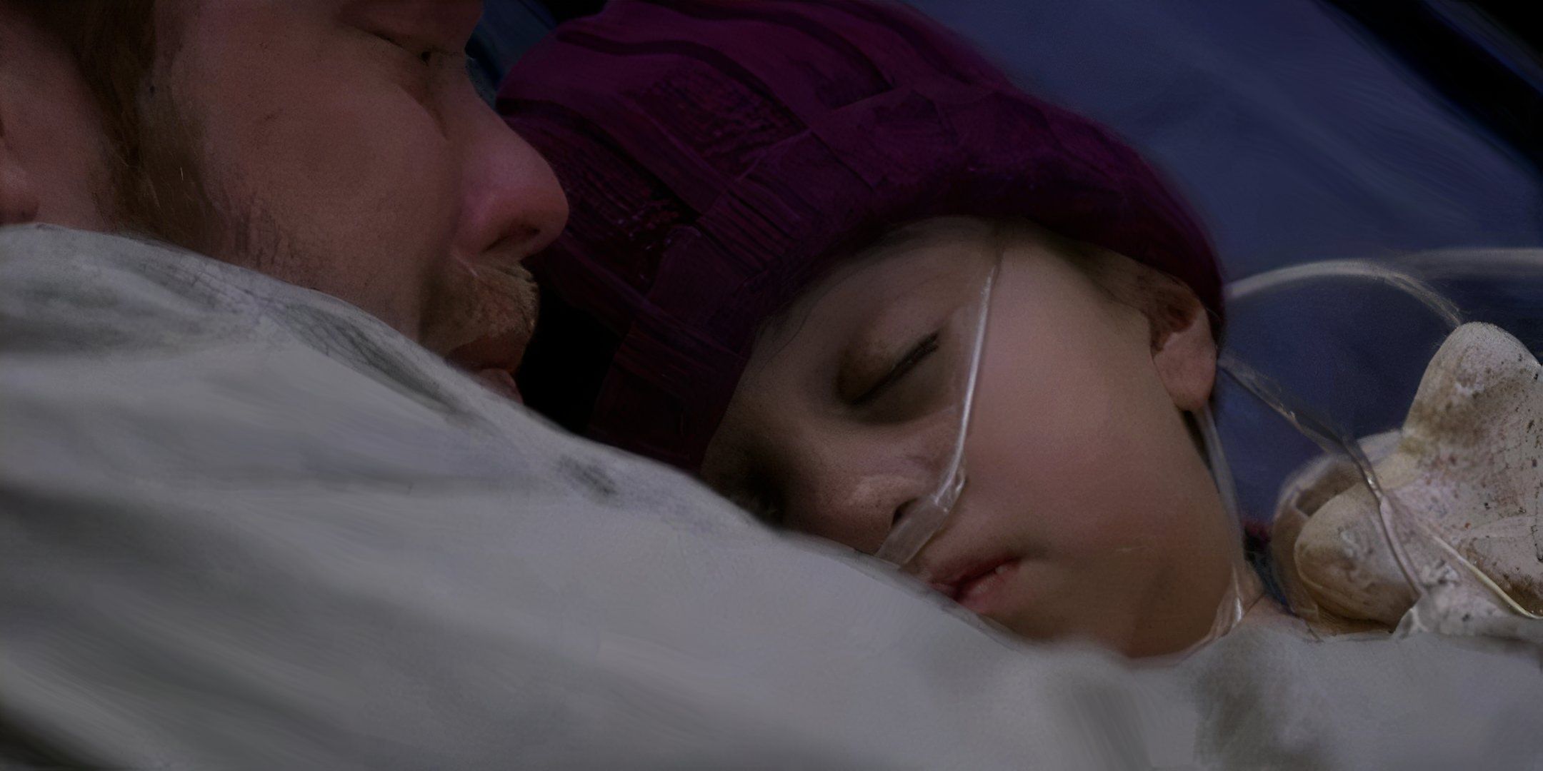 A closeup of a dying Jessica Smithson being held by her crying dad in Grey's Anatomy