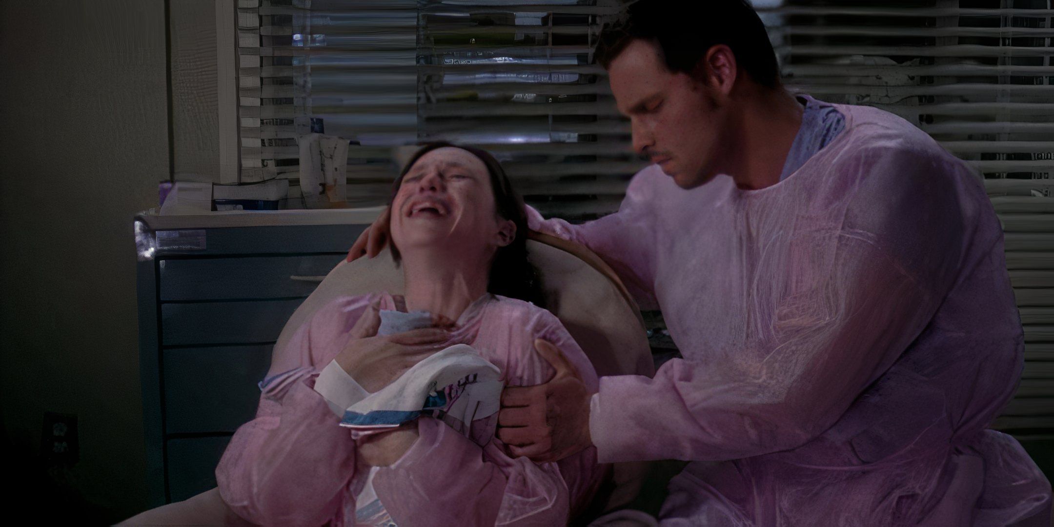 Alex Karev comforting Morgan Peterson as she sobs while holding her dead baby in Grey's Anatomy