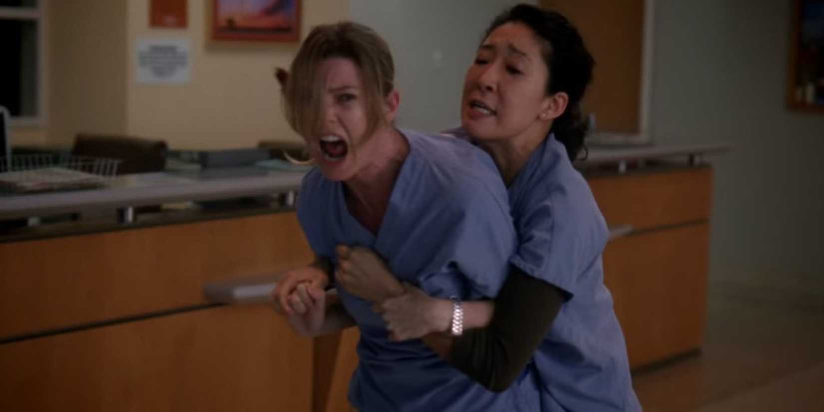 Cristina Yang holding back a screaming Meredith Grey in Grey's Anatomy shooting episode