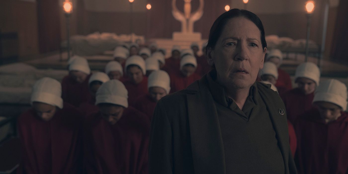Aunt Lydia looks shocked standing in front of the handmaids in The Handmaid's Tale