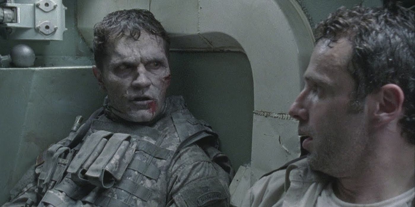 Rick Grimes (Andrew Lincoln) stares at a walker in a tank in The Walking Dead's pilot episode