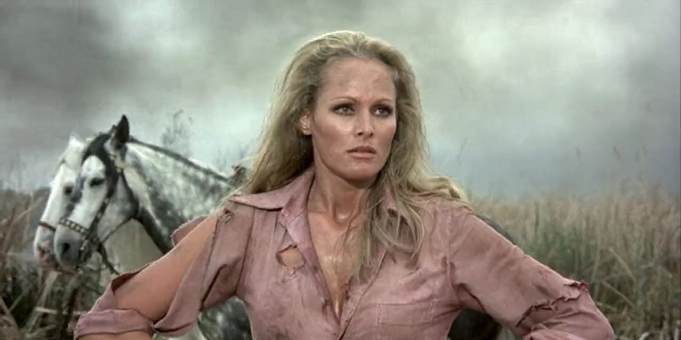 Ursula Andress stands in front of two horses in 1971's Red Sun