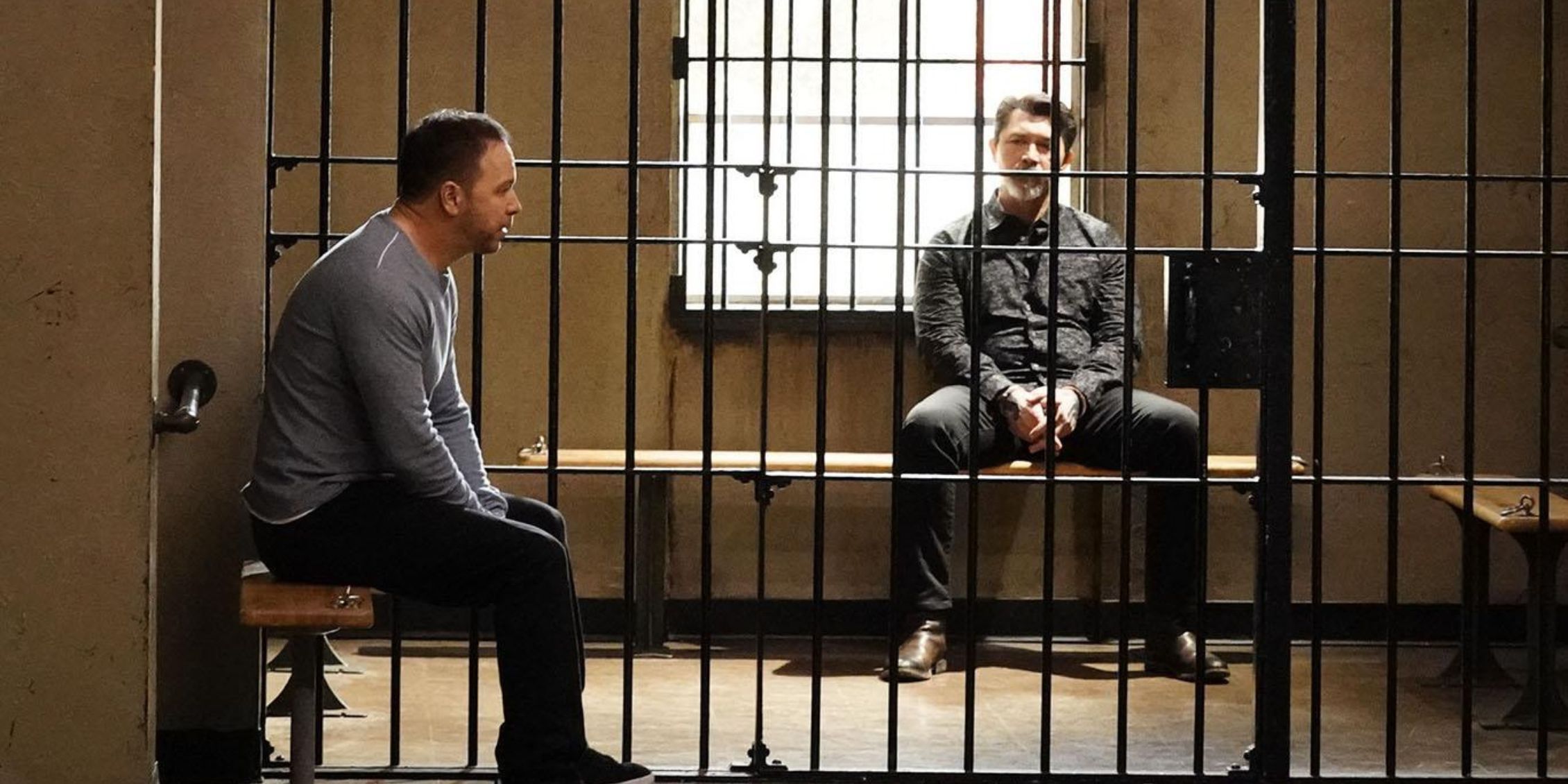 Danny Reagan (Donnie Wahlberg) speaks with Luis Delgado (Lou Diamond Phillips) while the latter is in a prison cell in Blue Bloods
