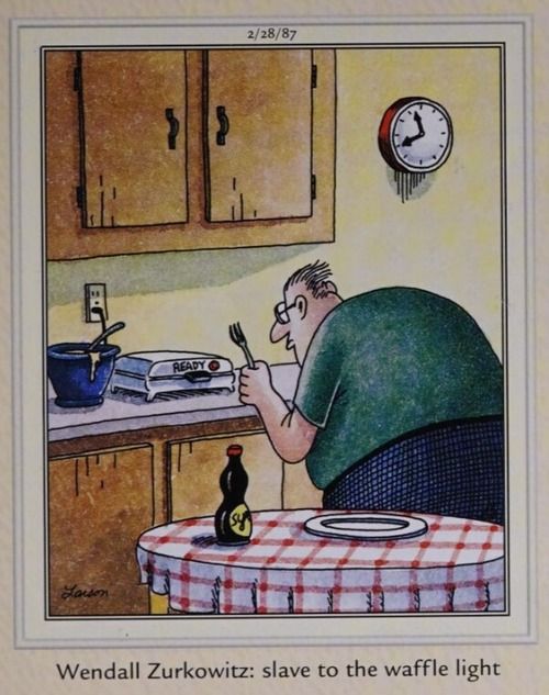 A man waits for a waffle machine