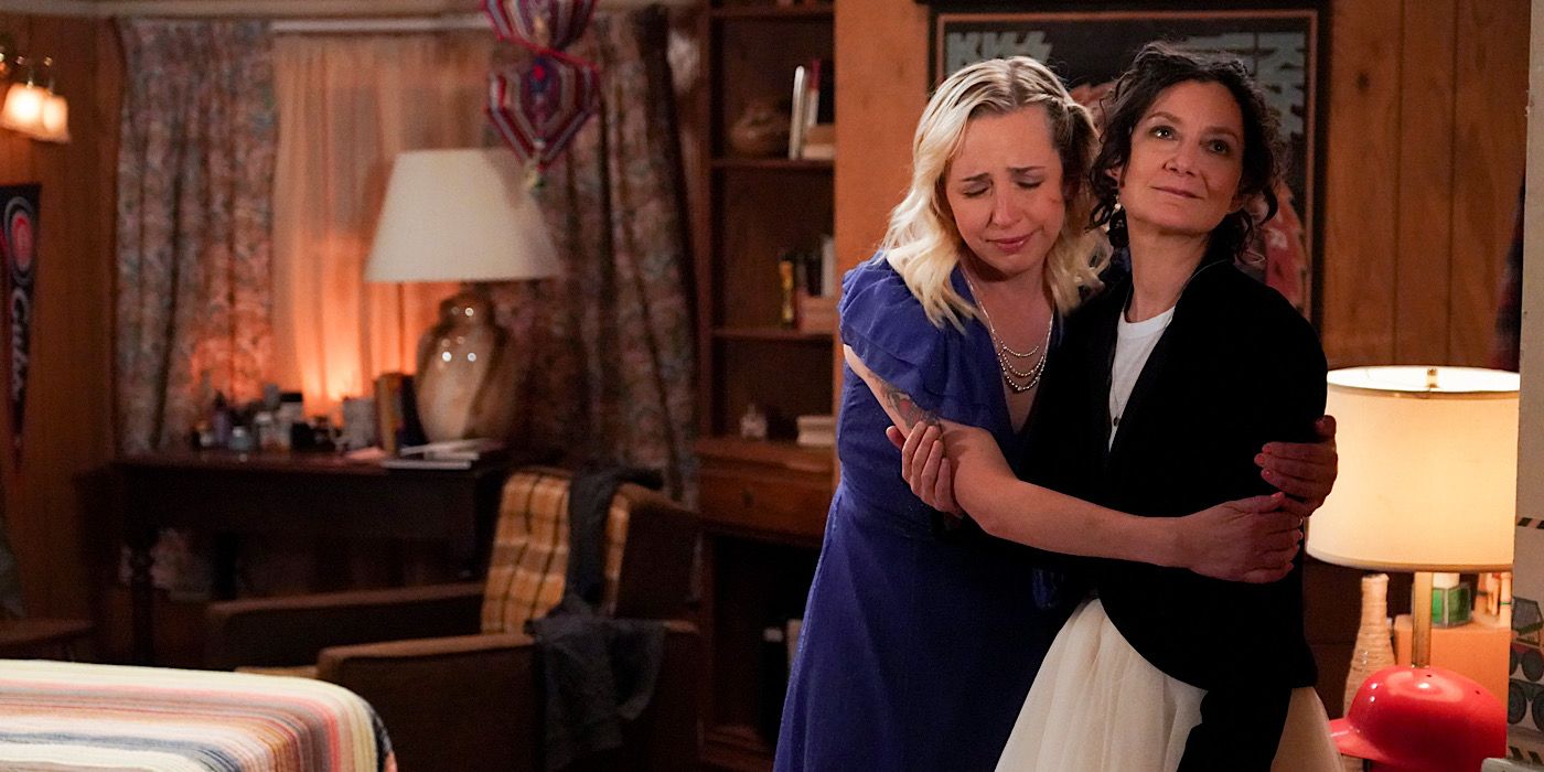 Harris hugs Darlene and cries in the room.