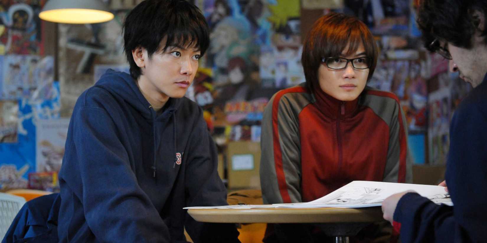Moritaka Mashiro and Akito Takagi getting their manga reviewed in Bakuman