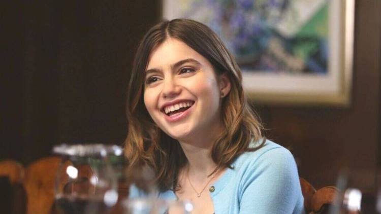 Nicky Reagan-Boyle smiling at someone offscreen in Blue Bloods