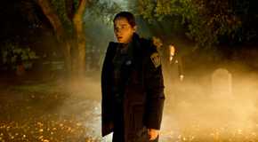 Melanie Scrofano as Dana Cypress in a cemetery in Revival