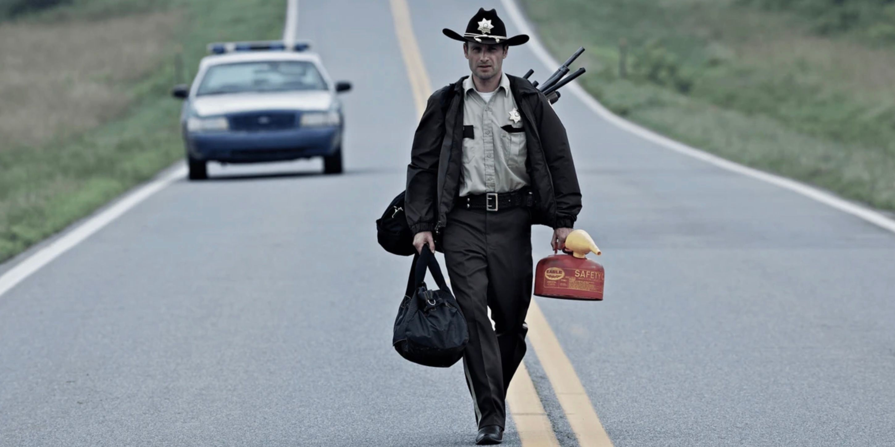 Rick Grimes walking down a road on The Walking Dead