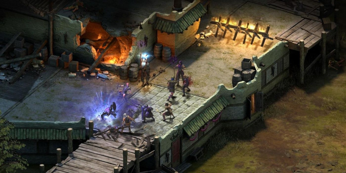 A gameplay still from Tyranny with the player's party engaged in combat in a settlement.