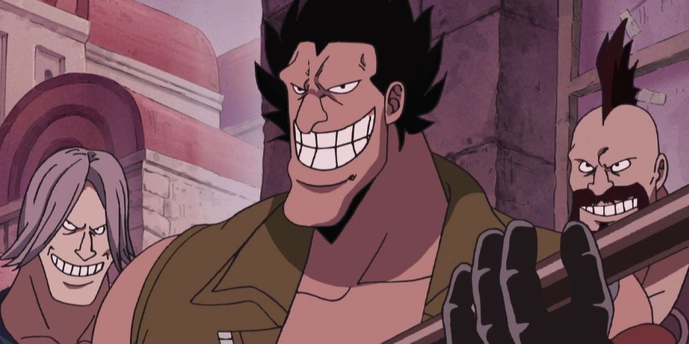 Zambai grins widely while holding a metal rod.