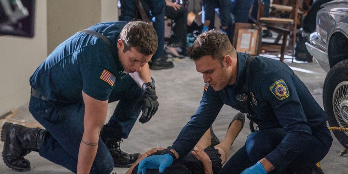 Buck (Oliver Stark) and Eddie (Ryan Guzman) work on a patient in 9-1-1.