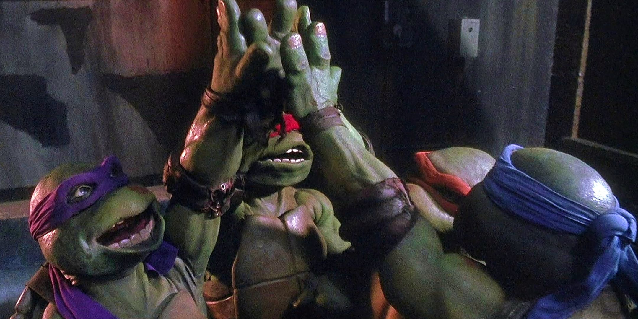 TMNT high-fiving in the 1990 movie