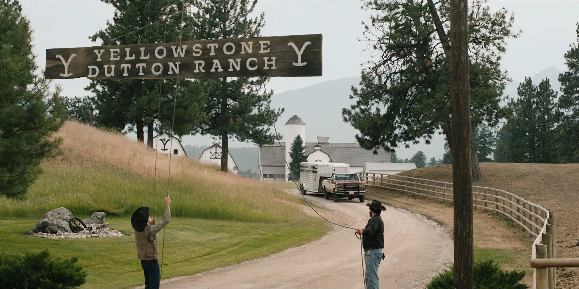 The Cowboys lower the Yellowstone Dutton Ranch sign in Yellowstone Season 5
