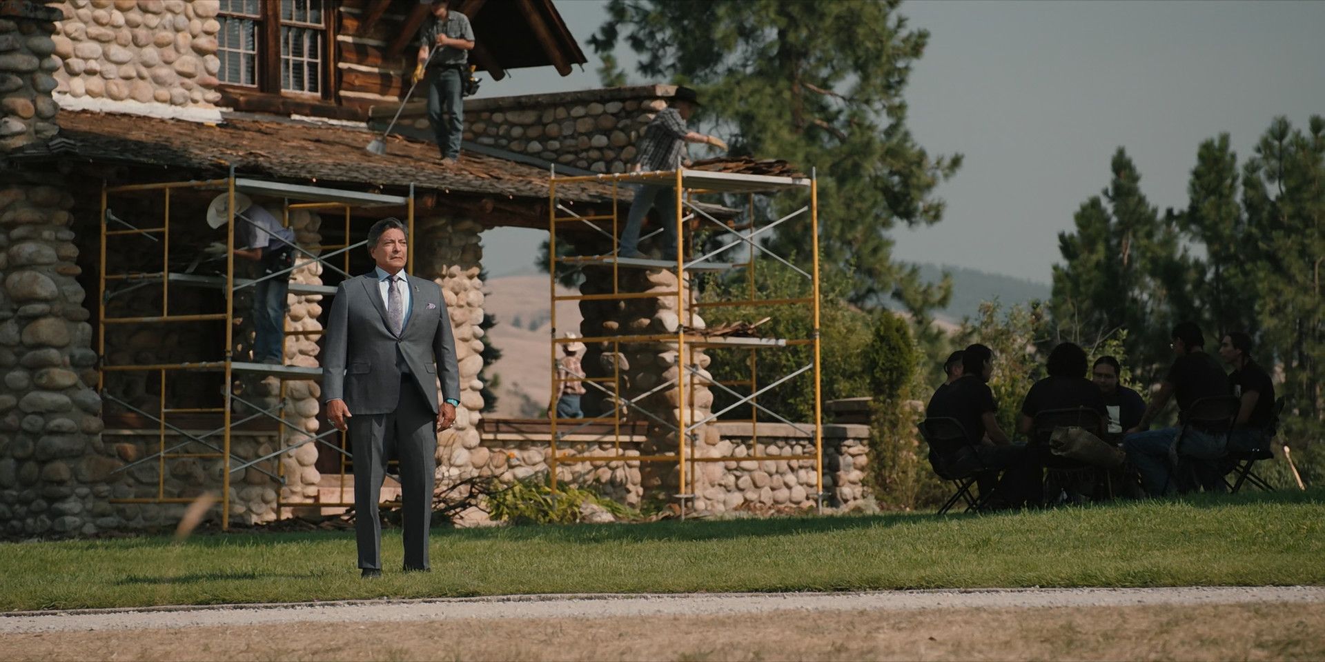 Thomas Rainwater stands before the Yellowstone Ranch in Yellowstone Season 5