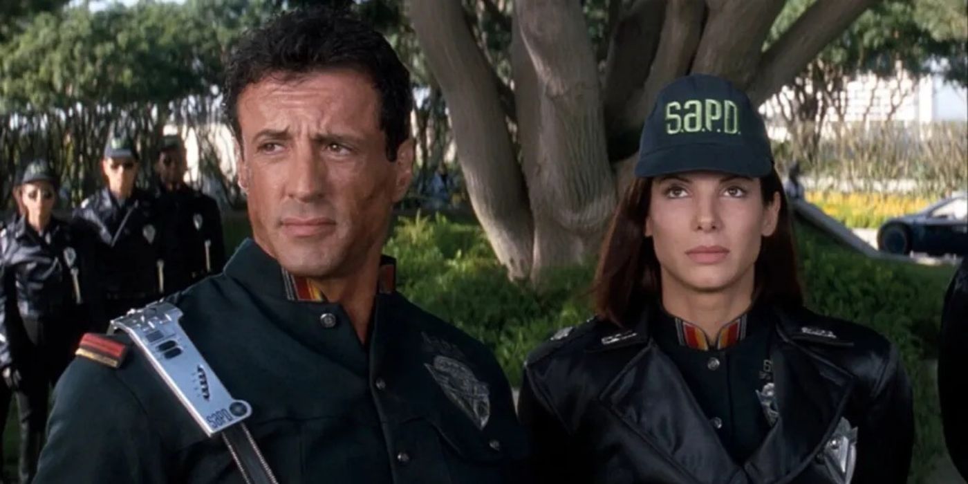Sylvester Stallone como John Spartan y Sandra Bullock como Lenina Huxley de la película Demolition Man (1993)