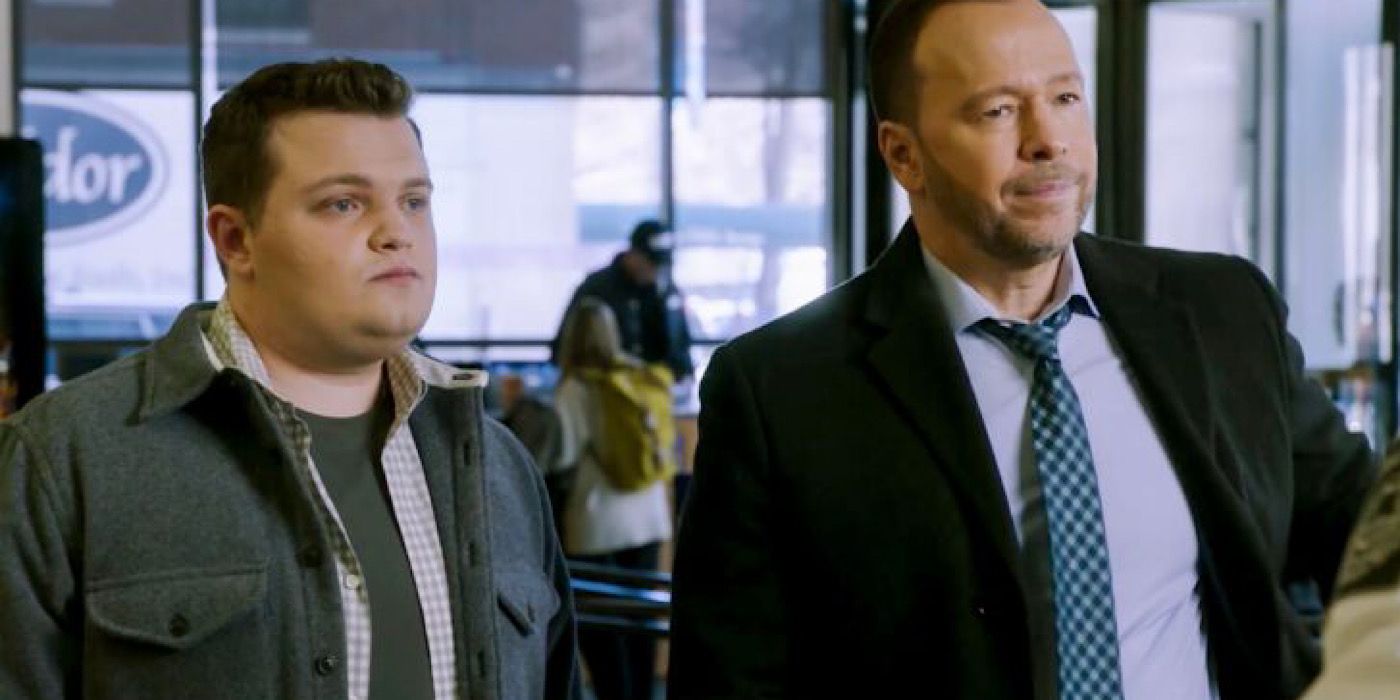 Sean and Danny Reagan stand beside each other.