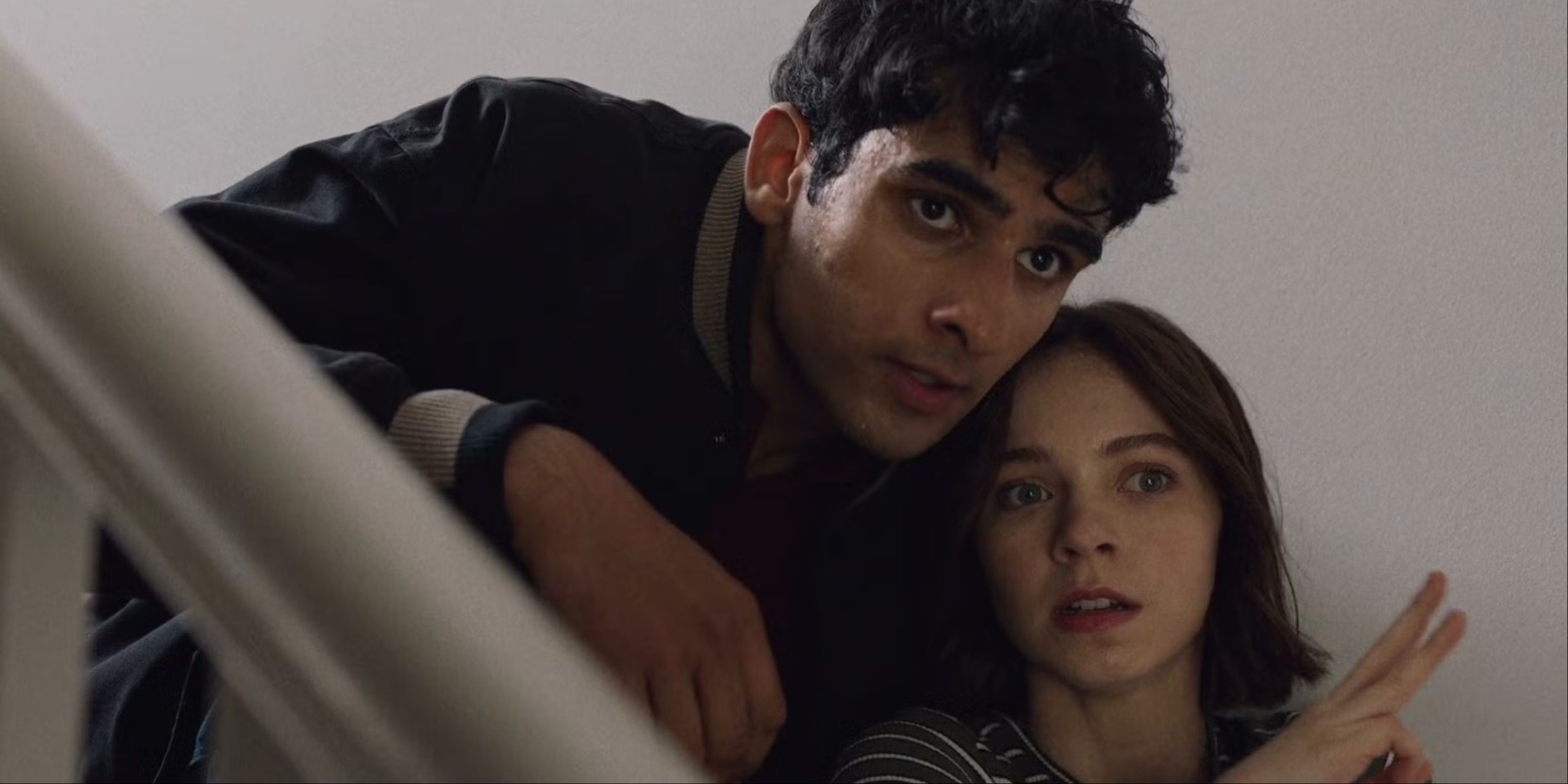Pip and Ravi at the stairs in A Good Girl's Guide to Murder