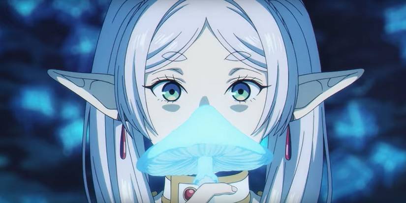 Frieren from Frieren: Beyond Journey's End looks intrigued by the glowing bule mushroom she is holding in Season 2.