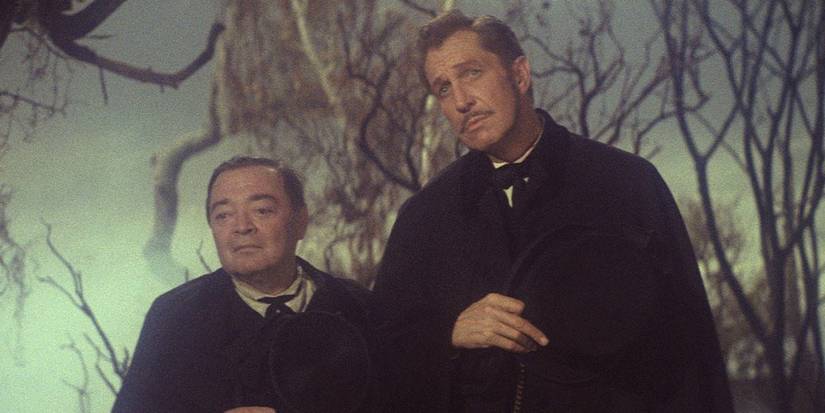 Trumbull (Vincent Price) and Gillie (Peter Lorre) are held near a grave in the comedy of terrors.