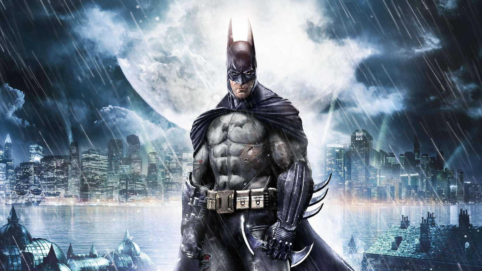 Batman looking straight ahead with Gotham behind him
