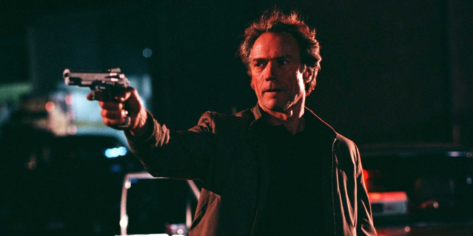 Sergeant Nick Pulovski (Clint Eastwood) points to a weapon on someone in the recruit.