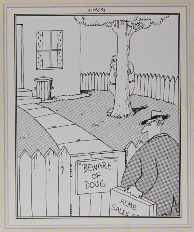 A man hiding behind a tree
