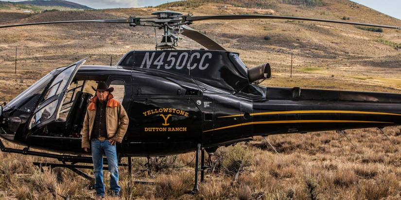John Dutton stands in front of the Yellowstone helicopter