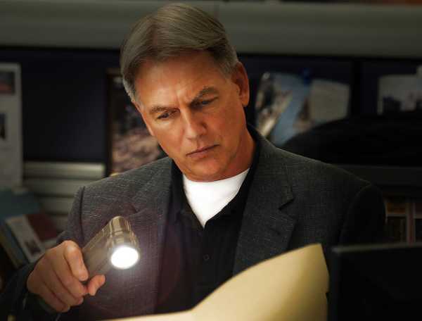 Mark Harmon looking at a file in NCIS