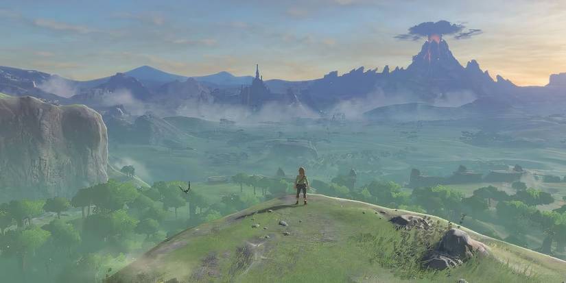 An overhead shot showing the vast world with Link looking over the cliff