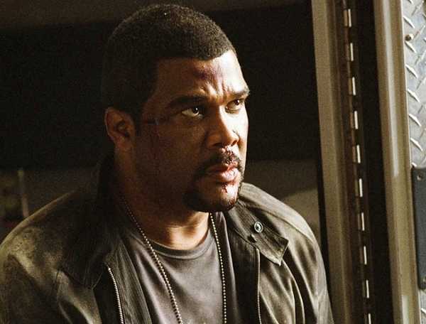 Dr. Alex Cross sits in an ambulance in Alex Cross (2012)
