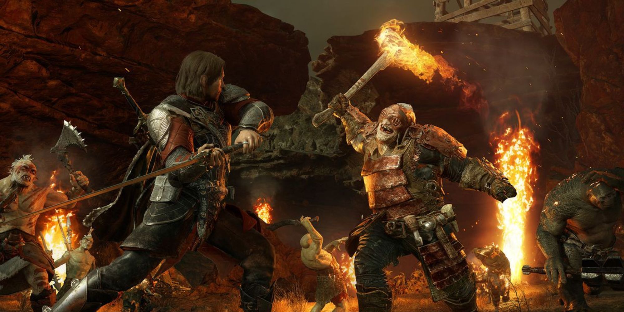 Talion swings his sword against an orc wielding a flaming weapon in Middle-earth: Shadow of War.