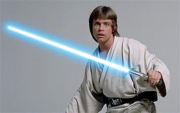 Luke Skywalker holding a blue lightsaber in Star Wars