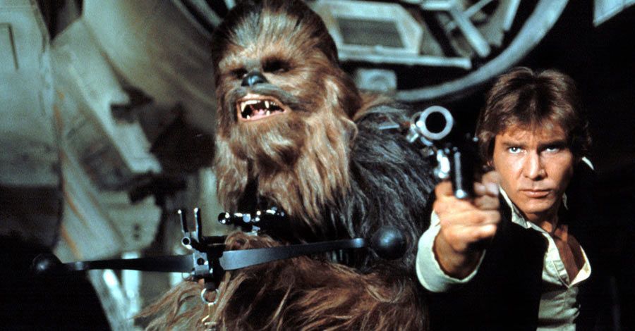 Han Solo and Chewbacca hold guns and point them at their enemies in Star Wars